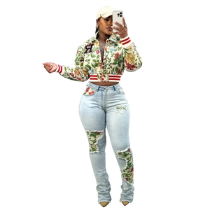 Detailed close-up of floral jacquard jacket with rib knit cuffs and varsity patch