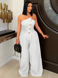 Elegant white strapless wide-leg jumpsuit featuring large decorative gold buttons