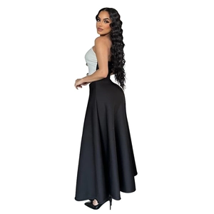 Detail of elegant two-piece set featuring white bandeau top with buttons and black maxi skirt