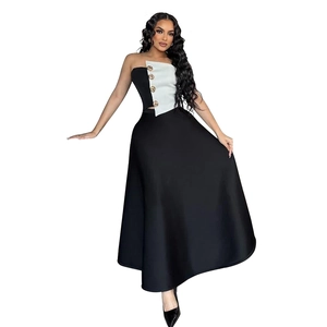 Detail of color-block tube top with gold buttons and high-waist maxi skirt set