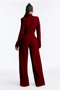 Detail of dark red ribbed knit fabric on wide-leg jumpsuit with elegant back view