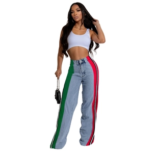 Detail of high waisted wide leg jeans with colorful side stripes and light wash denim
