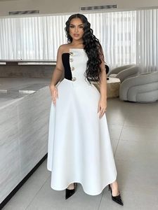 Elegant black and white strapless two-piece set with A-line skirt and golden buttons