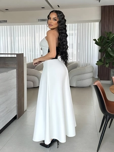 Elegant two-piece set with black tube top and high-waisted white A-line skirt