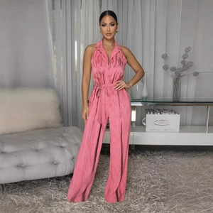 Pink halter neck wide leg jumpsuit with marble print texture and waist tie