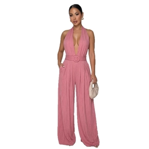 Halter deep V-neck wide leg jumpsuit in dusty rose with belt and crescent handbag