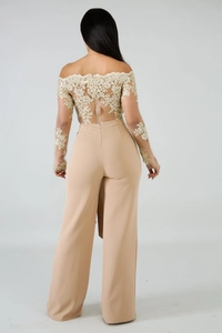 Detailed back view of apricot jumpsuit featuring lace embroidery and mesh sleeves