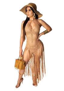 Detail view of khaki crochet bodysuit featuring long bohemian tassels and beach hat