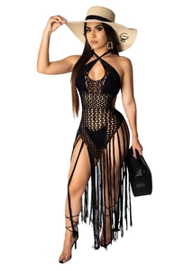 Detail of black crochet knit mesh cover-up dress featuring long fringe hem and halter neck
