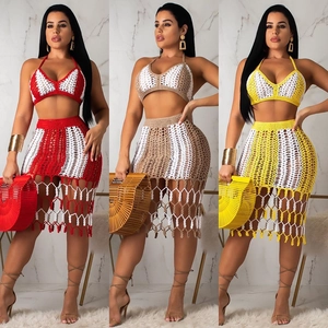 Detail of bohemian crochet two-piece set featuring hollow-out patterns and fringe hem design
