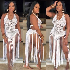 White crochet halter beach dress with intricate mesh knit and long tassel fringe hemline