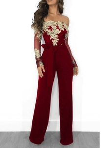 Detail of wine red wide-leg jumpsuit with gold lace embroidery and off-shoulder mesh sleeves