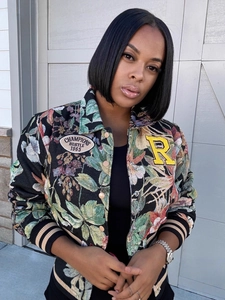 Women's vintage floral bomber jacket with embroidered varsity patches and ribbed trims