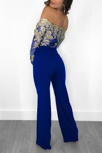Detail of royal blue off-shoulder jumpsuit with gold lace embroidery and sheer mesh top
