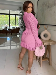 Detail of rose pink crochet knit two-piece set featuring fringe trim and mesh texture