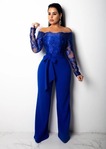 Close-up of royal blue lace embroidery on the off-shoulder wide-leg jumpsuit with belt