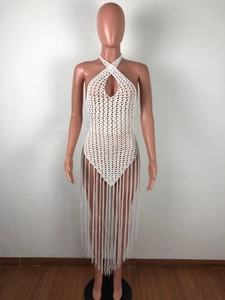 Detailed knit pattern on a white halter neck beach cover-up with long tassels
