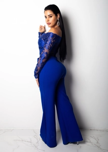 Rear view of navy blue off-shoulder lace top and matching wide leg jumpsuit