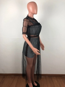 Detail of sheer black mesh top with lettuce edge trim and matching shorts set