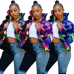 Detail of colorful camo puffer jacket with hood and cropped cut in street fashion style