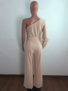 Detail view of the one-shoulder jumpsuit's back and waist tie on a mannequin