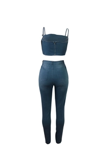Rear view of deep blue denim two-piece set featuring back zipper and slim fit high-waist pants