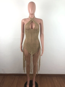 Detailed view of golden brown crochet beach dress with cross halter neck and long fringe trim