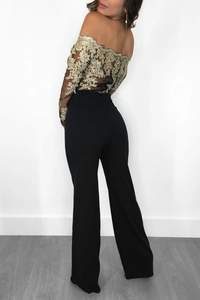Detail of off-shoulder mesh jumpsuit with gold floral lace embroidery and wide legs