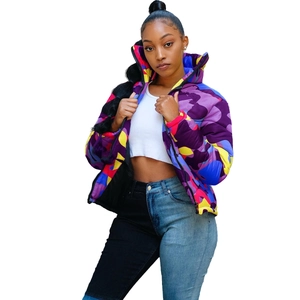 Close-up of vibrant purple and blue camouflage puffer jacket with zip-up high collar