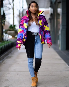 Detail of colorful camo puffer jacket paired with two-tone denim pants and work boots