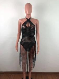 Detailed texture of black crochet halter beach dress with long fringe and hollow-out design