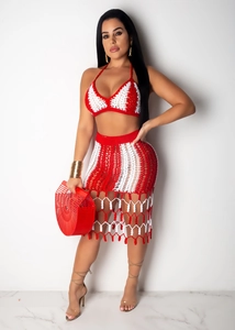 Detail view of red and white striped crochet knit set with hollow texture and fringe hem