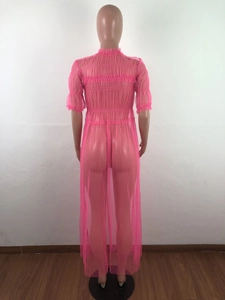 Detail of pink mesh dress featuring ruffled trim and layered pleated texture for women
