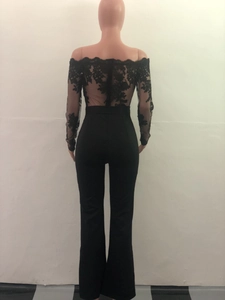 Rear view of black off-the-shoulder jumpsuit featuring intricate lace detailing and wide legs