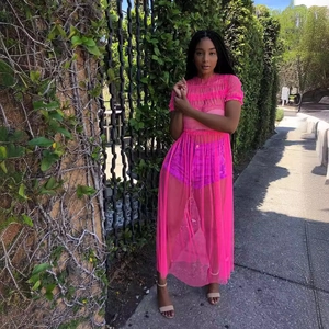 Vibrant hot pink sheer mesh maxi dress with layered ruffles and short sleeves for summer