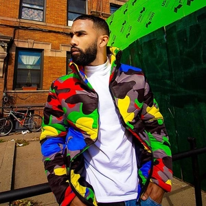 Detail of colorful rainbow camo puffer jacket featuring stand collar and street style