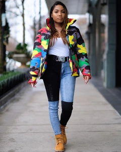 Detail shot of a colorful camouflage puffer jacket with vibrant color-block patchwork