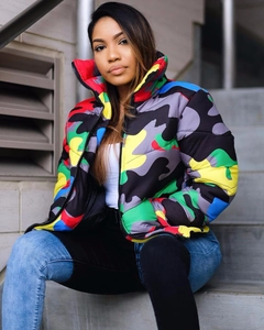 Detailed close-up of vibrant multi-color camo puffer jacket with high stand collar and black zipper