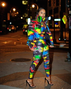 Street view of colorful camouflage puffer jacket and slim leggings with vibrant print