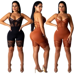 Close-up of lace patchwork bodysuit with eyelash lace trim and slimming corset design