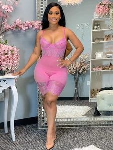 Detail of pink lace bodysuit with sheer mesh panels and delicate eyelash lace trimming