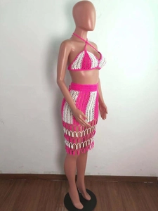 Detail of pink and white striped crochet beach set with fringe tassel hem and halter top