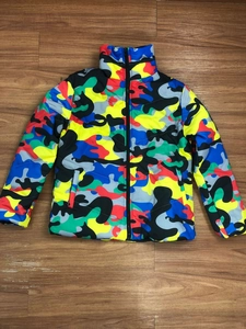 Detailed flat lay of colorful camouflage puffer jacket with a high stand-up collar and zipper