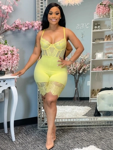 Bright yellow lace corset jumpsuit with sheer mesh panels and bodycon straps design