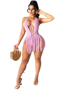 Detailed close-up of pink crochet fringe bodysuit with criss-cross halter neck design
