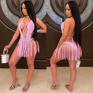 Pink crochet halter beach dress featuring intricate fringe details and open back design