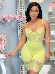 Detail of lime green lace trim and ribbed fabric on a sexy fashion bodysuit