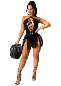 Detail of a black crochet hollow-out bodysuit with deep V-neck and long waist fringe