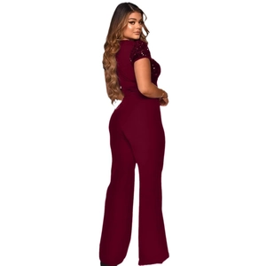 Close-up detail of burgundy short sleeves with sparkling sequin splicing on the jumpsuit
