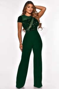 Detail view of dark green jumpsuit featuring sequin embroidery and sheer mesh panels